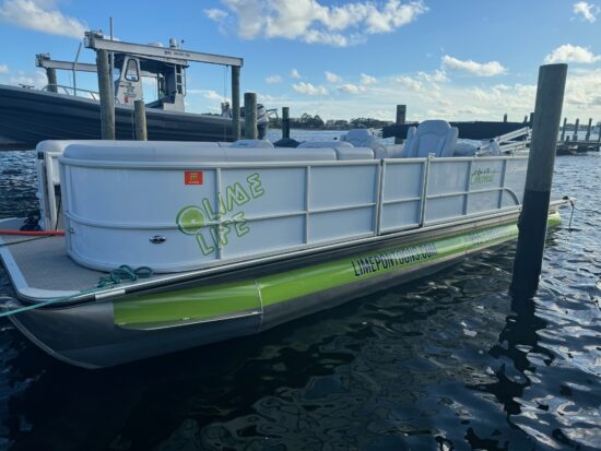 lime and cocunut pontoon boat docked