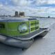 scenic beach along the destin harbor with pontoon boat